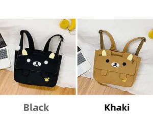 Detail view of khaki and black bear backpacks with cute ears and paw prints