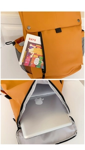Detail view of ginger yellow backpack showing laptop compartment and mesh side pocket