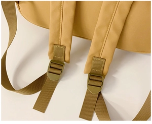 Close-up of adjustable padded shoulder straps on a large capacity children's backpack