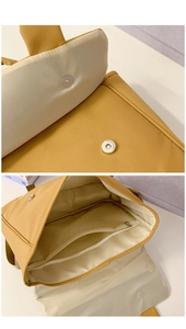 Detail view of large capacity kids backpack with magnetic closure and internal compartments