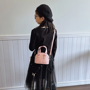 Pink shell-shaped mini handbag for girls featuring lychee texture and crossbody strap
