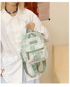 Detail of mini backpack with butterfly and bamboo leaf print on canvas material