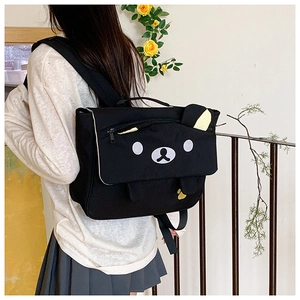 Detailed view of large capacity black cartoon bear school bag with 3D ears and embroidery