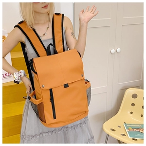 Kids orange high-capacity backpack with vertical zipper and mesh side pockets