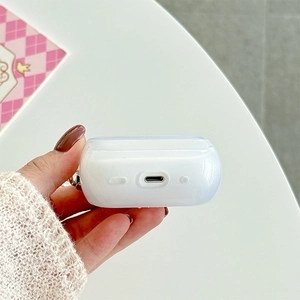 Detail view of precise charging port and speaker cutouts on the glittery white AirPods case