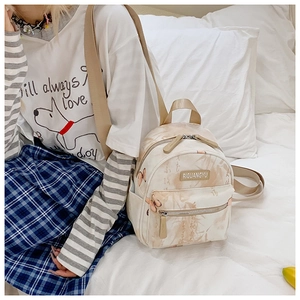 Detail of beige canvas backpack with butterfly and bamboo print in New Chinese style