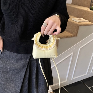 Mini cream leather crossbody bag with lace trim and elegant top handle for girls