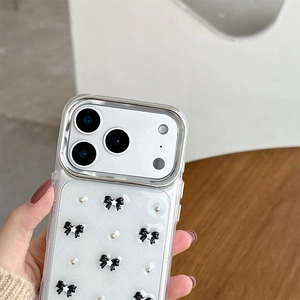 Detail of transparent iPhone case with 3D black bows and sparkling glitter finish