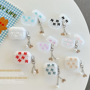 Clear AirPods case with 3D bow and pearl keychain in various pastel colors