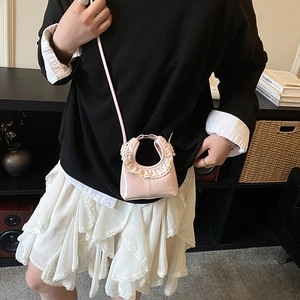 Mini pink shoulder bag for girls with white lace trim and round top handle