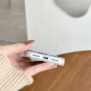Detailed close-up of precise speaker and charging port cutouts on this clear phone case