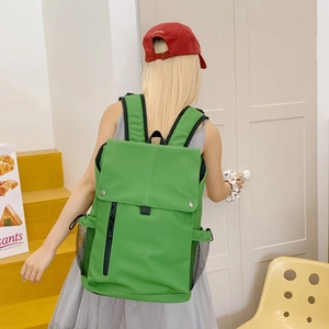 Vibrant green large capacity backpack with adjustable top flap and mesh side pockets