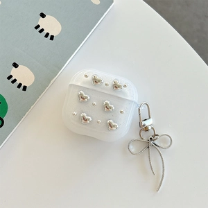 Glittery transparent AirPods case with silver heart detail and bow pendant accessory