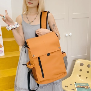 Orange durable nylon backpack with flap closure and side mesh pocket for children