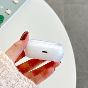Close-up of clear TPU case with precise bottom charging port cut-out for earbuds