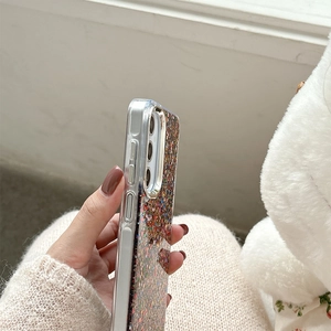 Detail shot of a glittery phone case with precise cutouts and slim ergonomic profile