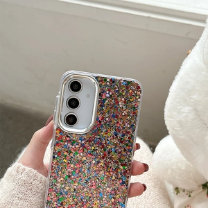 Macro shot of glitter phone case with silver camera ring on cozy knit background