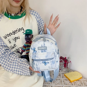 New Chinese style kids backpack featuring blue butterfly prints and artistic calligraphy