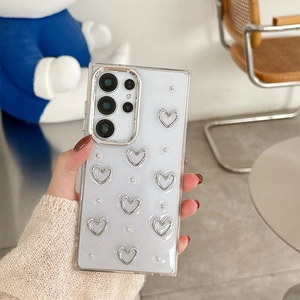 Sparkly light blue Samsung S25 Ultra case with 3D silver hearts and white pearls