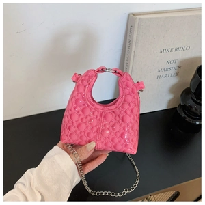 Close-up of pink bubble texture mini bag with glossy finish and silver chain strap