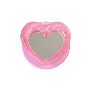 Magnetic heart-shaped phone grip and makeup mirror with pink glitter finish and stand