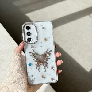 Detail of white glitter phone case with silver liquid butterfly and colorful rhinestones