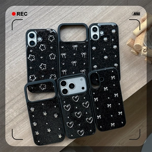 Glittery black iPhone case featuring 3D silver heart, bow, and flower metal ornaments