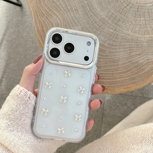 Clear iPhone case with silver 3D bows and pearls on a stylish textured background