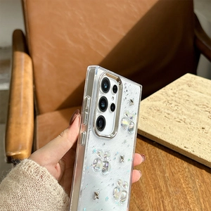 Detail of transparent glitter phone case with 3D colorful flowers and silver stars