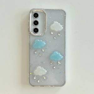 Detail of 3D cloud and water drop charms on a glittery transparent Samsung case