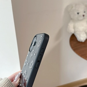 Detail view of black phone case with glitter back panel and silver metallic beads