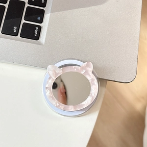 Detail of cat ear shaped makeup mirror phone stand with pink marble texture finish