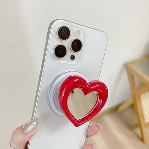 Red heart-shaped magnetic phone grip on smartphone with glossy resin finish for women