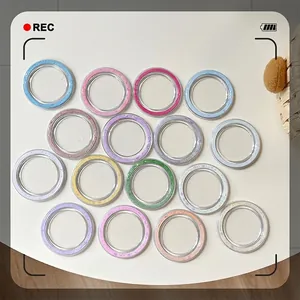 Set of 15 colorful glitter camera lens protectors for smartphones in various vibrant colors