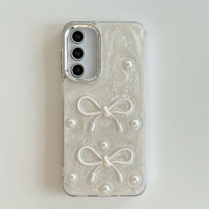 Detailed view of white pearl phone case featuring 3D bowknots and elegant bead textures