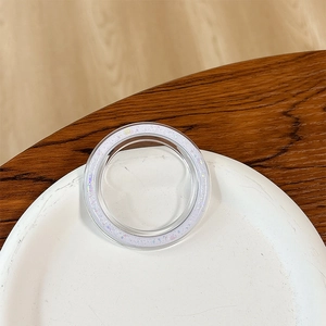 Close-up of a circular phone socket with glittered edges on a ceramic plate
