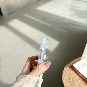 Detail of clear phone case with 3D cartoon character and precise side button cutouts