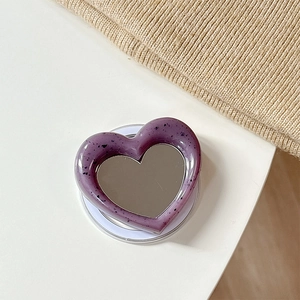 Minimalist purple heart-shaped MagSafe phone mirror with black ink splash resin finish
