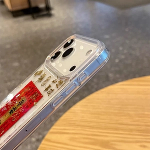 Detail shot of transparent iPhone case with gold lucky Chinese characters and camera protection