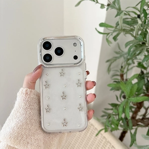 Detail of clear glitter iPhone case featuring silver star charms and pearl accents