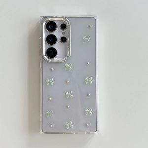 Close-up of clear Samsung S24 Ultra case with purple glitter and green 3D bows