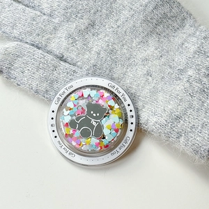 Detail of round magnetic phone grip featuring a glitter bear and 'Gift For You' text