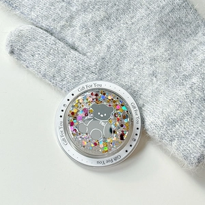Macro view of magnetic glitter bear phone socket with sparkling sequins and stars