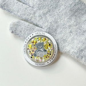 Detail of magnetic glitter bear phone socket with yellow sequins and gift for you text