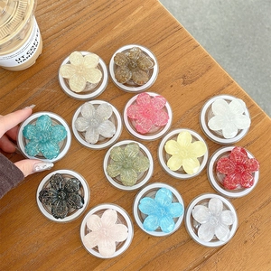 Magnetic glitter flower phone socket stand available in 13 various vibrant colors