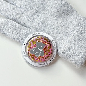 Detailed macro view of a glitter bear magnetic phone grip featuring Gift For You text