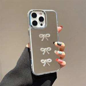 Mirror phone case for iPhone 16 Pro with three 3D silver crystal bow decorations