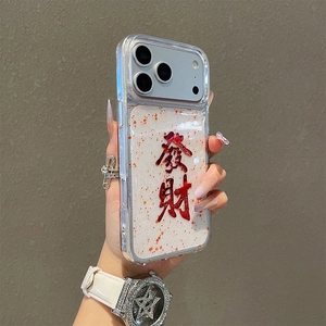 Macro shot of glittery iPhone case with red Chinese fortune character and gold powder details