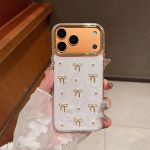 Detail of iPhone case with 3D gold bow, rose gold lens protector and pearly texture