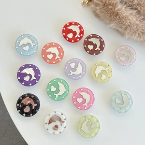 Flat lay of diverse glittery heart and dolphin pop sockets with rhinestone borders